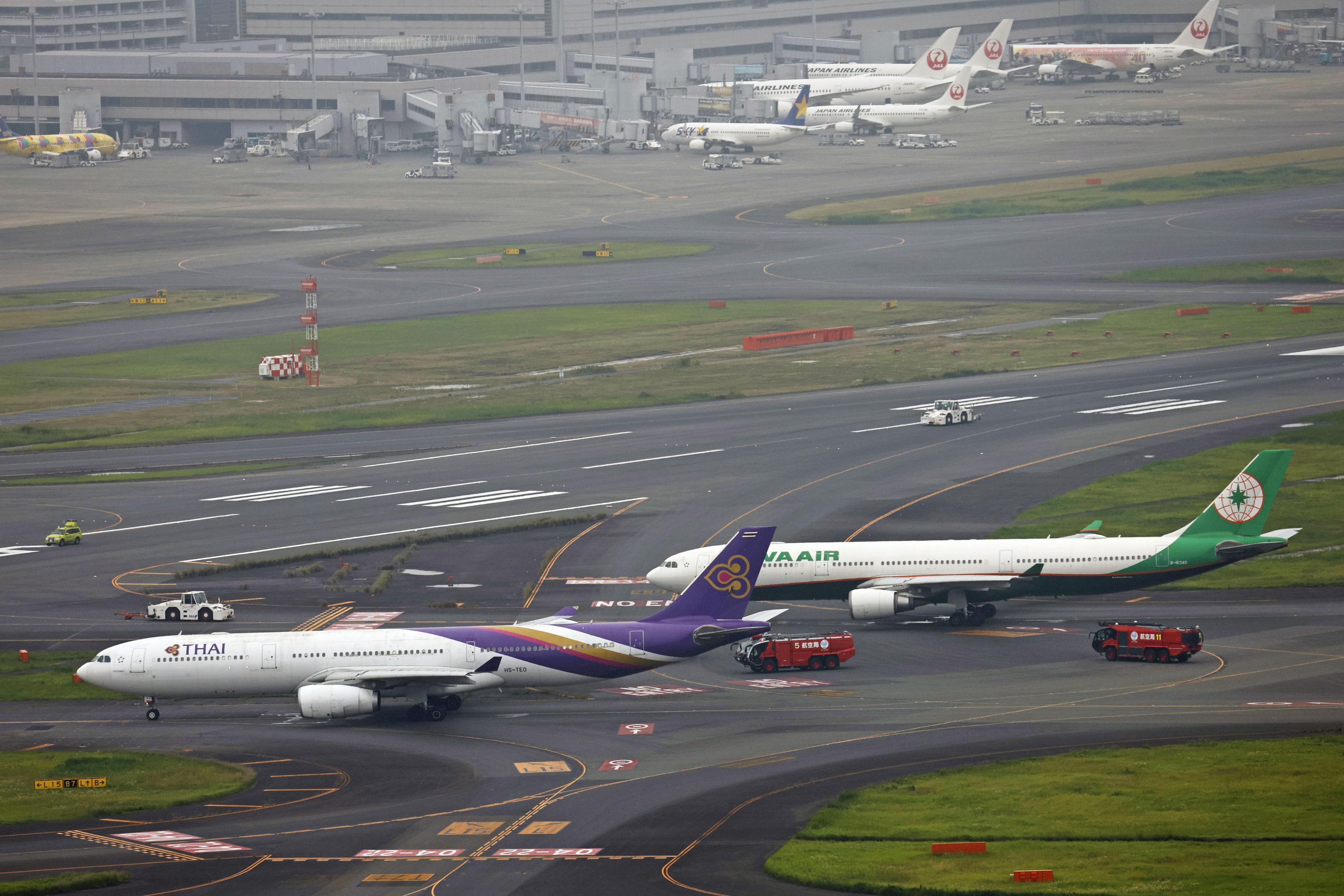 On  the  Move  , Thai Airways  A330  Aircraft  Hit  An  EVA Air  A330  Plane  That  Was  Stationary ,  Causing  Runway  Closure Temporarily.