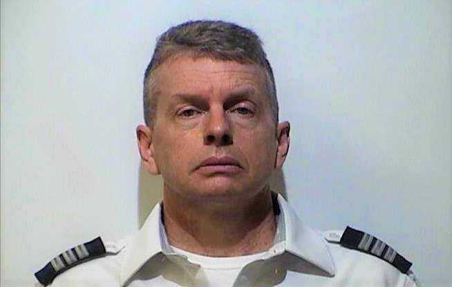 How a former American Airlines pilot was found guilty of murdering three people after being pulled off a jet ?